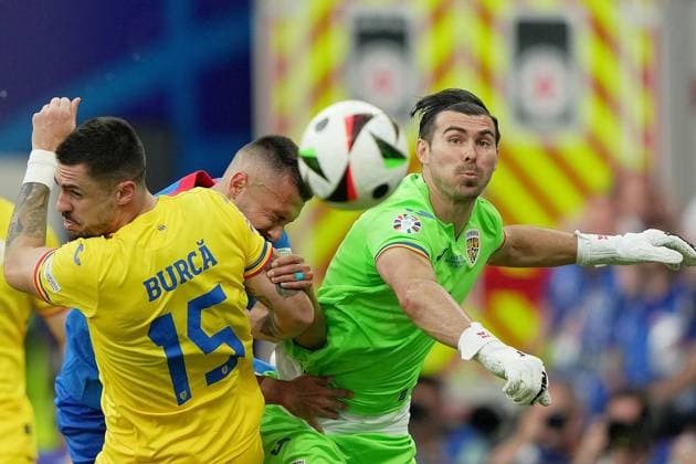 Romania s goalkeeper Florin Nita , Romania s Andrei Burca fight for the ball with Slovakia s Ivan Schranz during the Euro 2024 soccer match between Slovakia and Romania at the Frankfurt Arena , Frankfurt , Germany - Wednesday 26 June 2024. - Soccer .  Copyright: xSpada LaPressex