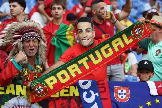 Portugal fans hold scarfs Georgia v Portugal, UEFA European Championship, EM, Europameisterschaft 2024, Group F, Football, Arena AufSchalke, Gelsenkirchen, Germany - 26 Jun 2024 EDITORIAL USE ONLY No use with unauthorised audio, video, data, fixture lists, club league logos or live services. Online in-match use limited to 120 images, no video emulation. No use in betting, games or single club league player publications.  Copyright: xPaulxCurrie Shutterstockx 14555619c