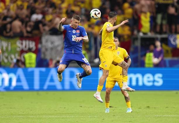 26 06 2024, European Football Championship, UEFA EURO 2024, Slovakia Romania, Group E, Arena Frankfurt, f l , Juraj Kuco Slovakia , Marius Mihai Marin Romania Copyright: HMBxMedia