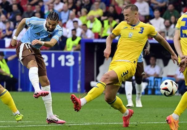 Belgium s Yannick Carrasco and Ukraine s Oleksandr Svatok pictured in action during a soccer game between Ukraine and Belgian national soccer team Red Devils, Wednesday 26 June 2024 in Stuttgart, Germany, the third match in the group stage of the UEFA EURO, EM, Europameisterschaft,Fussball 2024 European championships. DIRKxWAEM  x95329598x