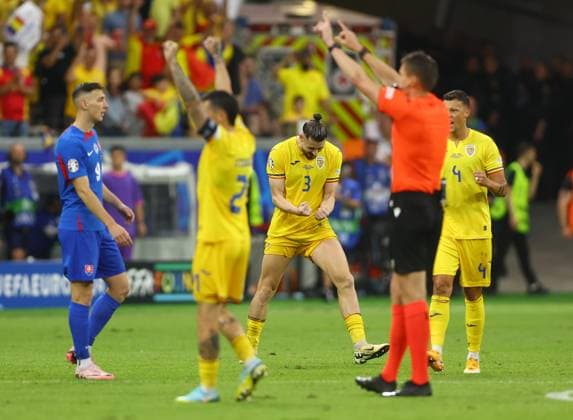 Radu Dragusin of Romania celebrates as the referee blows the full time whistle Slovakia v Romania, UEFA European Championship, EM, Europameisterschaft 2024, Group E, Football, Frankfurt Arena, Frankfurt am Main, Germany - 26 Jun 2024 EDITORIAL USE ONLY No use with unauthorised audio, video, data, fixture lists, club league logos or live services. Online in-match use limited to 120 images, no video emulation. No use in betting, games or single club league player publications. Copyright: xKieranxMcManus Shutterstockx 14555603bf