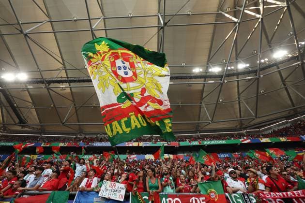 Portugal fans wave flags in the stands Georgia v Portugal, UEFA European Championship, EM, Europameisterschaft 2024, Group F, Football, Arena AufSchalke, Gelsenkirchen, Germany - 26 Jun 2024 EDITORIAL USE ONLY No use with unauthorised audio, video, data, fixture lists, club league logos or live services. Online in-match use limited to 120 images, no video emulation. No use in betting, games or single club league player publications.  Copyright: xPaulxCurrie Shutterstockx 14555619aa