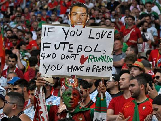 26 06 2024, Football UEFA EURO 2024, Preliminary round, Matchday 3, Georgia Portugal, in the Arena AufSchalke Gelsenkirchen, A fan from Portugal raises a poster, if you love futebol an dont love Ronaldo you have a Problem