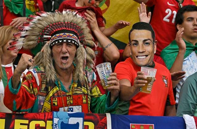 26 06 2024, Football UEFA EURO 2024, Preliminary round, Matchday 3, Georgia Portugal, in the Arena AufSchalke Gelsenkirchen, A Portuguese dressed as an Indian and next to him one dressed as Ronaldo