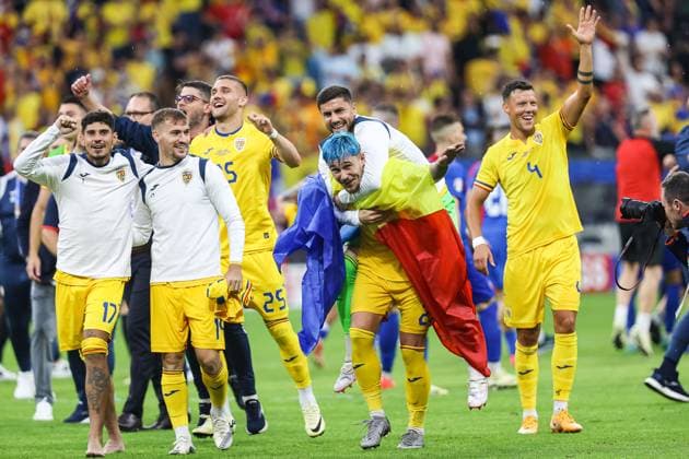 Final score 1 1 The Romanian team and fans celebrate as Andrei Florin Ratiu Romania, 02 piggybacks his teammate Darius Dumitru Olaru Romania, 14 , Adrian Rus Romania, 04 GER, Slovakia SVK vs Romania ROU , European Football Championship, UEFA EURO 2024, Group E, Matchday 3, 26 06 2024 GER, Slovakia SVK vs Romania ROU , European Football Championship, UEFA EURO 2024, Group E, Matchday 3, 26 06 2024 Frankfurt Copyright: xEibner-Pressefoto RogerxBuerkex EP