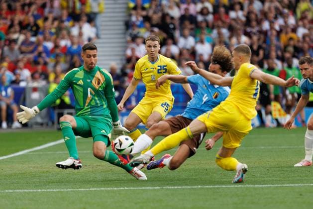 Wout Faes, blocks important shot by Artem Dovbyk next to Koen Casteels and Vladyslav Vanat seen during UEFA EURO, EM, Europameisterschaft,Fussball 2024 game between national teams of Ukraine and Belgium at MHPArena, Stuttgart, Germany Stuttgart MHPArena Germany Copyright: xMaciejxRogowskix ukrbel-4-2