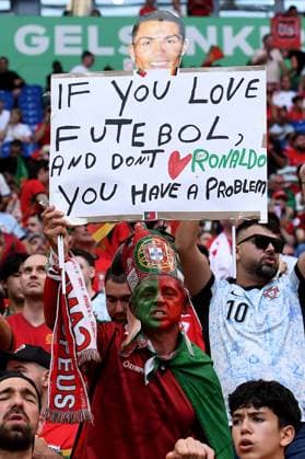 Soccer UEFA EURO 2024 group stage 3 matchday Georgia Portugal on 26 06 2024 at the Arena AufSchalke in Gelsenkirchen Fans spectators Portugal with poster with the inscription If you love futebol, and dont Ronaldo you have a problem xRx