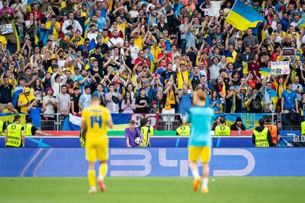 UEFA EURO 2024 Ukraine Belgium 26 06 2024 Georgiy Sudakov Ukraine, 14 , Yukhym Konoplia Ukraine, 2 after the end of the match, sad fans on the background, players are blurred UEFA EURO 2024 Ukraine Belgium Stuttgart Stadium, Stuttgart 26 06 2024 Copyright: xBEAUTIFULxSPORTS Buriakovx
