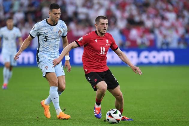 Soccer UEFA EURO 2024 Group Stage 3 Matchday Georgia Portugal on 26 06 2024 at Arena AufSchalke in Gelsenkirchen Diogo Dalot Portugal , left Giorgi Chakvetadze Georgia , right xRx