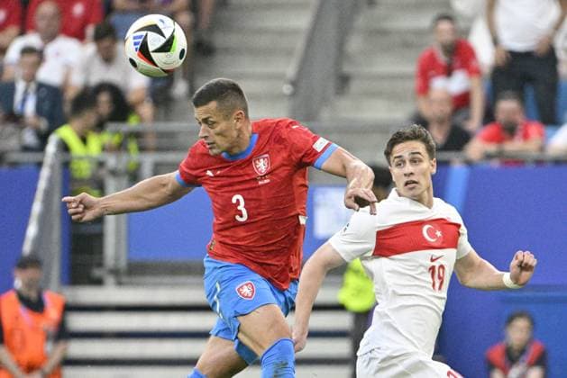 From left Czech Tomas Holes and Kenan Yildiz of Turkey in action during the Group F match of the European Football Championship: Turkey vs Czechia, in Hamburg, Germany, on June 26, 2024. (CTKxPhoto VitxSimanek) CTKPhotoP2024062609101  CTKPhotoP2024062609101