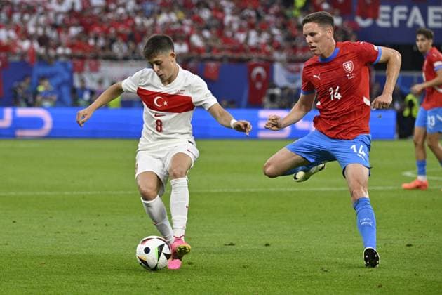 From left Arda Guler of Turkey and Czech Lukas Provod in action during the Group F match of the European Football Championship: Turkey vs Czechia, in Hamburg, Germany, on June 26, 2024. (CTKxPhoto VitxSimanek) CTKPhotoP2024062609109  CTKPhotoP2024062609109