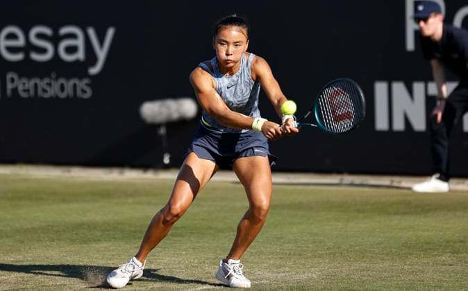 26th June 2024; Devonshire Park, Eastbourne, East Sussex, England: Rothesay International Eastbourne, Day 3, Yue Yua (CHN) plays a backhand against Daria Kasatkina  ActionPlus12660903 HongboxChen