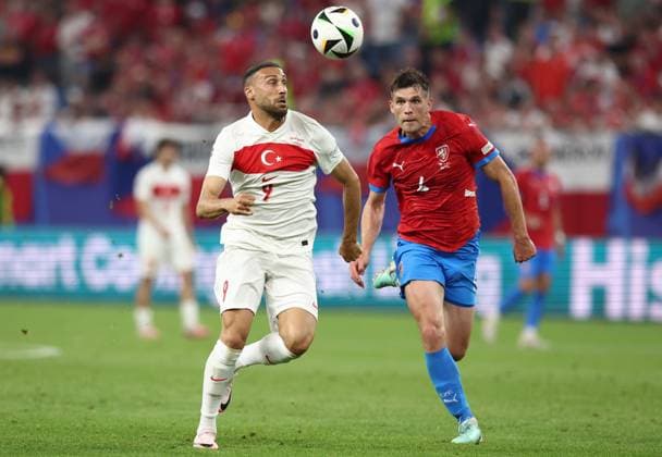 Cenk Tosun of Türkiye and Robin Hranac of Czechia chase the ball Czechia v Turkiye, UEFA European Championship, EM, Europameisterschaft 2024, Group F, Football, Volksparkstadion, Hamburg, Germany - 26 Jun 2024 EDITORIAL USE ONLY No use with unauthorised audio, video, data, fixture lists, club league logos or live services. Online in-match use limited to 120 images, no video emulation. No use in betting, games or single club league player publications. Copyright: xMattxWest Shutterstockx 14555612bt
