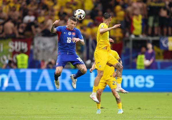 26 06 2024, European Football Championship, UEFA EURO 2024, Slovakia Romania, Group E, Arena Frankfurt, f l , Juraj Kuco Slovakia , Marius Mihai Marin Romania Copyright: HMBxMedia
