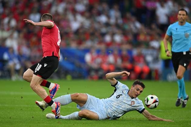 Giorgi Chakvetadze (Georgia)Joao Palhinha (Portugal) during the UEFA EURO, EM, Europameisterschaft,Fussball Germany 2024 match between Georgia 2-0 Portugal at Arena AufSchalke on June 26, 2024 in Gelsenkirchen, Germany. Noxthirdxpartyxsales  (257799726)