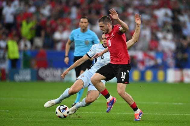 Giorgi Chakvetadze (Georgia)Joao Palhinha (Portugal) during the UEFA EURO, EM, Europameisterschaft,Fussball Germany 2024 match between Georgia 2-0 Portugal at Arena AufSchalke on June 26, 2024 in Gelsenkirchen, Germany. Noxthirdxpartyxsales  (257799730)