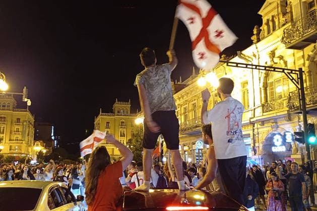 GEORGIA, TBILISI - JUNE 27, 2024: Football fans celebrate Georgiaâ€™s victory over Portugal in their UEFA EURO, EM, Europameisterschaft,Fussball 2024 Group F match. Georgiaâ€™s national team, Nationalteam won 2-0 to secure qualification to the knockout stages of the tournament. Inna Kukudzhanova TASS  0701935787st