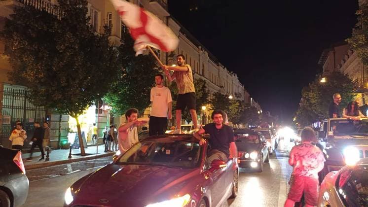 GEORGIA, TBILISI - JUNE 27, 2024: Football fans celebrate Georgiaâ€™s victory over Portugal in their UEFA EURO, EM, Europameisterschaft,Fussball 2024 Group F match. Georgiaâ€™s national team, Nationalteam won 2-0 to secure qualification to the knockout stages of the tournament. Inna Kukudzhanova TASS  0701935805st