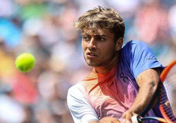 27th June 2024; Devonshire Park, Eastbourne, East Sussex, England: Rothesay International Eastbourne, Day 4; Flavio Cobolli (ITA) plays a backhand against Billy Harris (GBR) in the mens singles quarter-final match  ActionPlus12661018 HongboxChen