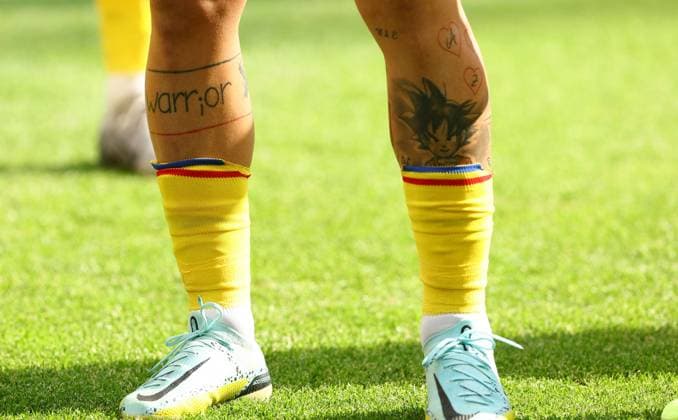 The tattooed legs of Nicolae Stanciu of Romania Slovakia v Romania, UEFA European Championship, EM, Europameisterschaft 2024, Group E, Football, Frankfurt Arena, Frankfurt am Main, Germany - 26 Jun 2024 EDITORIAL USE ONLY No use with unauthorised audio, video, data, fixture lists, club league logos or live services. Online in-match use limited to 120 images, no video emulation. No use in betting, games or single club league player publications. Copyright: xKieranxMcManus Shutterstockx 14555603co