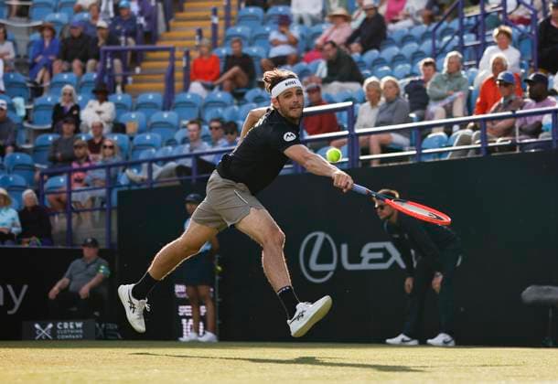 27th June 2024; Devonshire Park, Eastbourne, East Sussex, England: Rothesay International Eastbourne, Day 4; Taylor Fritz (USA) plays a backhand against Juncheng Shang (CHN) in the quarter-final match  ActionPlus12661156 HongboxChen