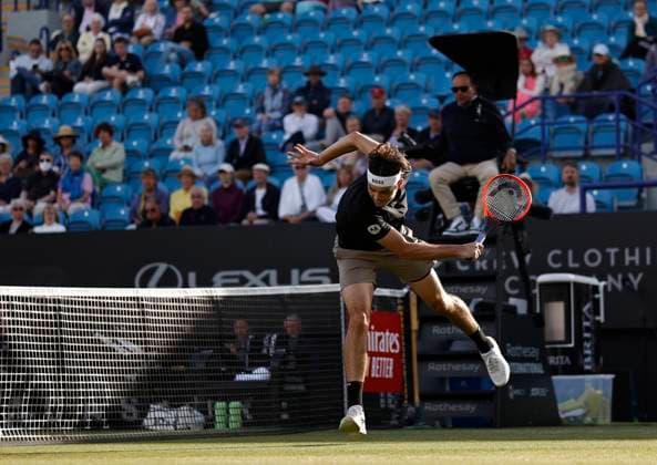 27th June 2024; Devonshire Park, Eastbourne, East Sussex, England: Rothesay International Eastbourne, Day 4; Taylor Fritz (USA) plays a backhand against Juncheng Shang (CHN) in the quarter-final match  ActionPlus12661158 HongboxChen