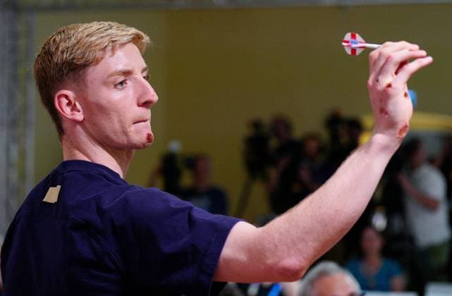 Anthony Gordon of England playing darts showing his bruises England press conference, PK, Pressekonferenz UEFA European Championship, EM, Europameisterschaft 2024, Round of 16, Football, Spa & Golf Resort Weimarer Land, Blankenhain, Germany, 28 Jun 2024 EDITORIAL USE ONLY No use with unauthorised audio, video, data, fixture lists, club league logos or live services. Online in-match use limited to 120 images, no video emulation. No use in betting, games or single club league player publications. Copyright: xDavexShopland Shutterstockx 14560774ag