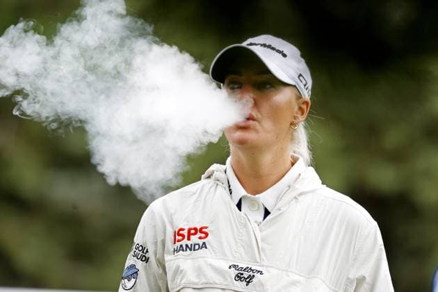 MIDLAND, MI - JUNE 28: LPGA, Golf Damen golfer Charley Hull blows smoke while vaping on the 4th tee box during the second round of the LPGA Dow Championship on June 28, 2024, at Midland Country Club in Midland, Michigan. (Photo by Brian Spurlock Icon Sportswire) GOLF: JUN 28 LPGA Dow Championship EDITORIAL USE ONLY Icon2406287
