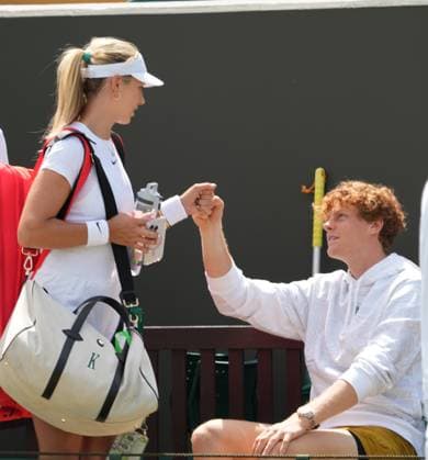 Tennis - 2024 Wimbledon Championships Training practice Yannick Sinner says hello to Katie Boulter after she had practiced with his girlfriend, Anna Kalinskaya 