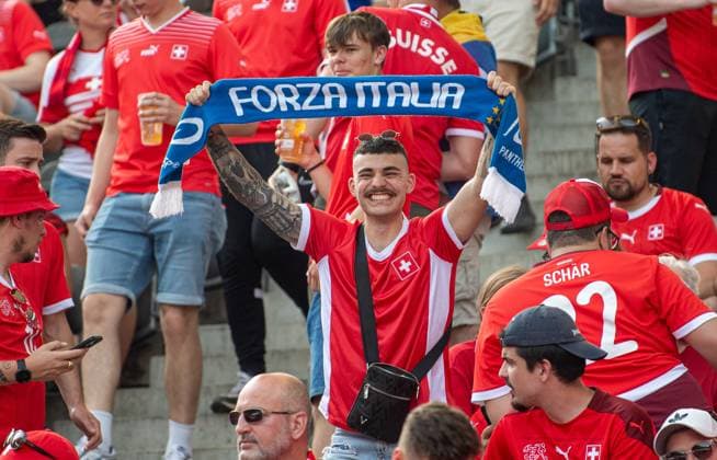 Soccer, Men, Season 2023 24, Euro 2024 round of 16 in Berlin, Switzerland Italy, Swiss fan with Italy scarf, 29 06 2024, Copyright: xSebastianxRäppold MatthiasxKochx