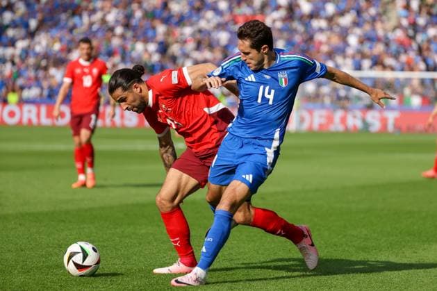 Ricardo Rodriguez Switzerland, 13 in duel with Federico Chiesa Italy, 14 , Football, UEFA , European Championship, Round of 16 2024, Switzerland vs Italy, 29 06 2024, Olympiastadion Berlin, Berlin, Germany Berlin Olympiastadion Berlin Berlin Germany Copyright: xGrantxHubbsx