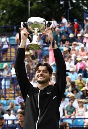 29th June 2024; Devonshire Park, Eastbourne, East Sussex, England: Rothesay International Eastbourne, Day 6; Taylor Fritz (USA) celebrates with the trophy after winning the mens singles final match against Max Purcell (AUS)  ActionPlus12661510 HongboxChen