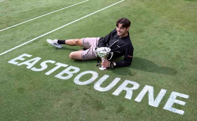 29th June 2024; Devonshire Park, Eastbourne, East Sussex, England: Rothesay International Eastbourne, Day 6; Taylor Fritz (USA) celebrates with the trophy after winning the mens singles final match against Max Purcell (AUS)  ActionPlus12661512 HongboxChen
