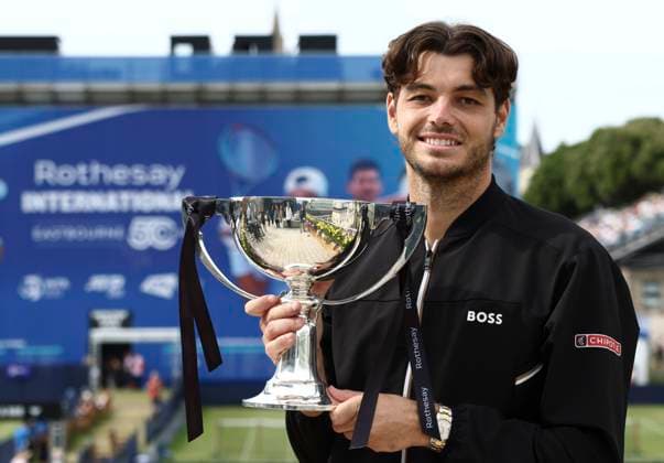 29th June 2024; Devonshire Park, Eastbourne, East Sussex, England: Rothesay International Eastbourne, Day 6; Taylor Fritz (USA) celebrates with the trophy after winning the mens singles final match against Max Purcell (AUS)  ActionPlus12661515 HongboxChen
