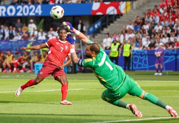 Goalkeeper Gianluigi Donnarumma of Italy saves from Breel Embolo of Switzerland Switzerland v Italy, UEFA European Championship, EM, Europameisterschaft 2024, Round of 16, Football, Olympiastadion, Berlin, Germany - 29 Jun 2024 EDITORIAL USE ONLY No use with unauthorised audio, video, data, fixture lists, club league logos or live services. Online in-match use limited to 120 images, no video emulation. No use in betting, games or single club league player publications. Copyright: xPaulxCurrie Shutterstockx 14562043at