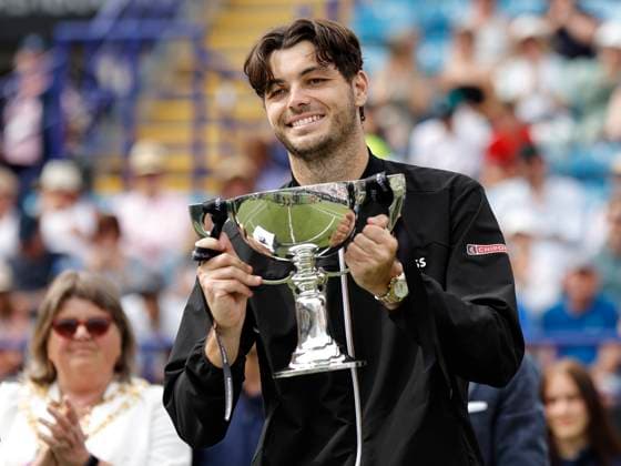 29th June 2024; Devonshire Park, Eastbourne, East Sussex, England: Rothesay International Eastbourne, Day 6; Taylor Fritz (USA) celebrates with the trophy after winning the mens singles final match against Max Purcell (AUS)  ActionPlus12661545 HongboxChen