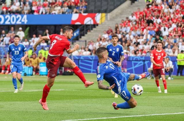 Remo Freuler of Switzerland scores the opening goal 1-0 as Gianluca Mancini of Italy blocks Switzerland v Italy, UEFA European Championship, EM, Europameisterschaft 2024, Round of 16, Football, Olympiastadion, Berlin, Germany - 29 Jun 2024 EDITORIAL USE ONLY No use with unauthorised audio, video, data, fixture lists, club league logos or live services. Online in-match use limited to 120 images, no video emulation. No use in betting, games or single club league player publications. Copyright: xPaulxCurrie Shutterstockx 14562043bd