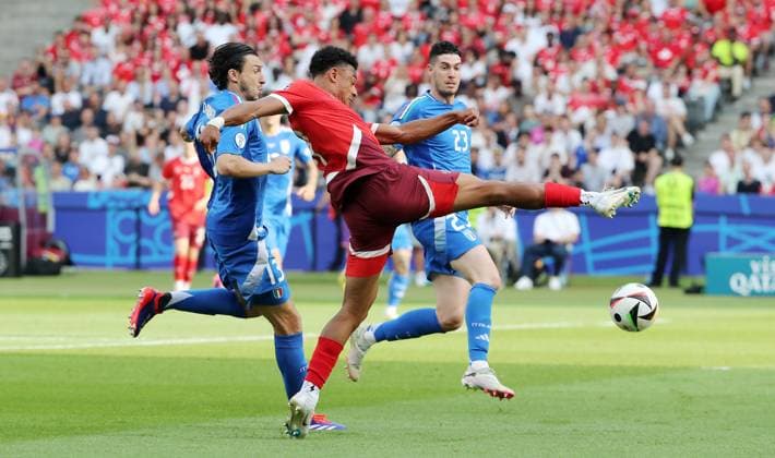 Matteo Darmian, Dan Ndoye, Alessandro Bastoni duel Match scene Action Sport Football European Football Championship Euro 2024 European Championship Men Season 2023 2024 29 06 2024 Switzerland SUI vs Italy ITA in Berlin DFL regulations prohibit any use of photographs as image sequences and or quasi video