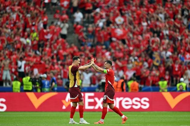 290624 KAI SCHWOERER Captain Granit Xhaka of Switzerland (R) celebrates the win in the UEFA EURO, EM, Europameisterschaft,Fussball 2024 round of 16 match between Switzerland and Italy at Olympiastadion on June 29, 2024 in Berlin, Germany. 290624-CPL-SUIvITA-017