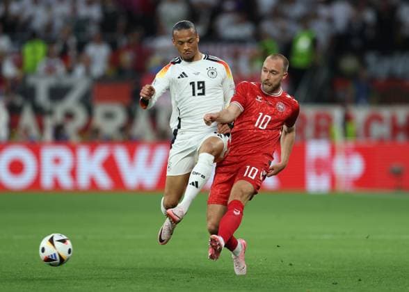 Dortmund, Germany, 29th June 2024. Leroy Sane of Germany tackles Christian Eriksen of Denmark during the UEFA European Championships Group 16 match at the BVB Stadion, Dortmund. Picture credit should read: Paul Terry Sportimage EDITORIAL USE ONLY. No use with unauthorised audio, video, data, fixture lists, club league logos or live services. Online in-match use limited to 120 images, no video emulation. No use in betting, games or single club league player publications. SPI-3213-0025