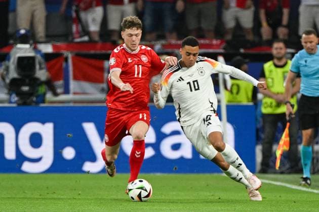 Soccer, Men, Season 2023 24, Euro EM 2024 Round of 16 in Dortmund , Germany Denmark, Andreas Skov Olsen Denmark and Jamal Musiala Germany in a duel , 29 06 2024, Copyright: xMatthiasxKochx