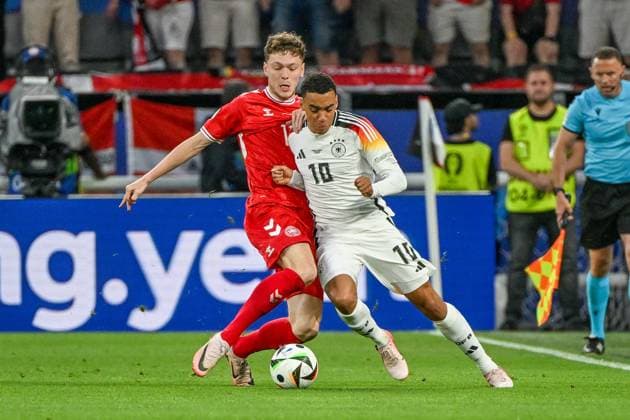 Soccer, Men, Season 2023 24, Euro EM 2024 Round of 16 in Dortmund , Germany Denmark, Andreas Skov Olsen Denmark and Jamal Musiala Germany in a duel , 29 06 2024, Copyright: xMatthiasxKochx