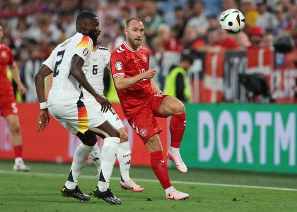Dortmund, Germany, 29th June 2024. Christian Eriksen of Denmark evades Antonio Rudiger of Germany during the UEFA European Championships Group 16 match at the BVB Stadion, Dortmund. Picture credit should read: Paul Terry Sportimage EDITORIAL USE ONLY. No use with unauthorised audio, video, data, fixture lists, club league logos or live services. Online in-match use limited to 120 images, no video emulation. No use in betting, games or single club league player publications. SPI-3213-0029