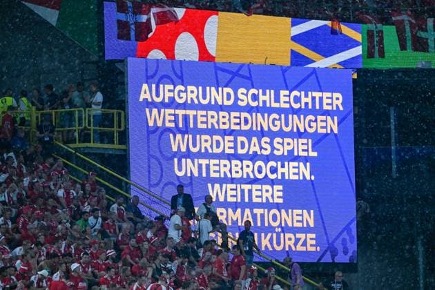 Soccer, Men, Season 2023 24, Euro EM 2024 Round of 16 in Dortmund , Germany Denmark, The scoreboard reads Due to bad weather conditions the match was interrupted , 29 06 2024, Copyright: xMatthiasxKochx