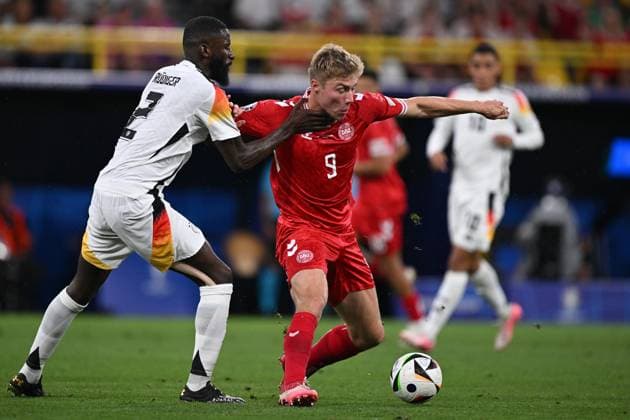 Germany Soccer Euro 2024 Germany - Denmark 8719318 29.06.2024 Germany s Antonio Rudiger and Denmark s Rasmus Hojlund struggle for the ball during the UEFA EURO, EM, Europameisterschaft,Fussball 2024 Round of 16 soccer match between Germany and Denmark at the BVB Stadion Dortmund, in Dortmund, Germany. Alexey Filippov Sputnik Dortmund Germany  Copyright: xAlexeyxFilippovx