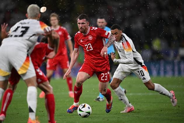 Germany Soccer Euro 2024 Germany - Denmark 8719340 29.06.2024 Germany s Jamal Musiala, right, and Denmark s Pierre-Emile Hojbjerg struggle for the ball during the UEFA EURO, EM, Europameisterschaft,Fussball 2024 Round of 16 soccer match between Germany and Denmark at the BVB Stadion Dortmund, in Dortmund, Germany. Alexey Filippov Sputnik Dortmund Germany  Copyright: xAlexeyxFilippovx