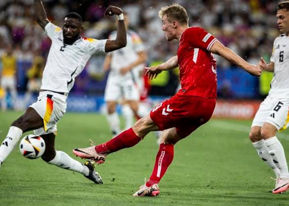 Dortmund, Signal Iduna Park, 29 06 2024 Rasmus Hoejlund of denmark kicks the ball against Antonio Ruediger of germany during the match UEFA European Championship 2024 Germany v Denmark