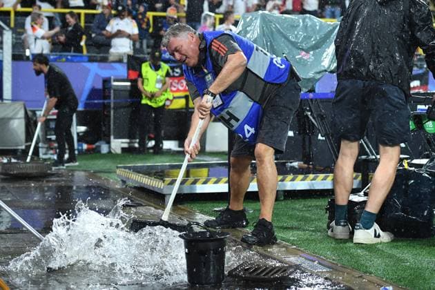 Soccer UEFA EURO 2024 Round of 16 Germany Denmark on 29 06 2024 at BVB Stadium Dortmund in Dortmund Helpers push the water into a drain with a slide valve xRx