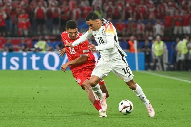 Soccer, Men, Season 2023 24, Euro EM 2024 Round of 16 in Dortmund , Germany Denmark, Alexander Bah Denmark and Jamal Musiala Germany in a duel , 29 06 2024, Copyright: xMatthiasxKochx