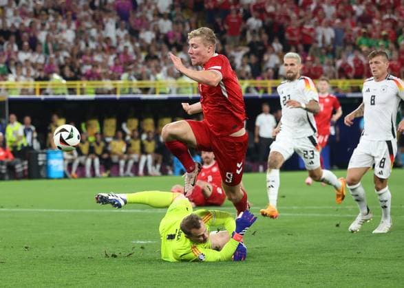 Dortmund, Germany, 29th June 2024. Manuel Neuer of Germany saves from a clean through Rasmus Hojlund of Denmark during the UEFA European Championships Group 16 match at the BVB Stadion, Dortmund. Picture credit should read: Paul Terry Sportimage EDITORIAL USE ONLY. No use with unauthorised audio, video, data, fixture lists, club league logos or live services. Online in-match use limited to 120 images, no video emulation. No use in betting, games or single club league player publications. SPI-3213-0052